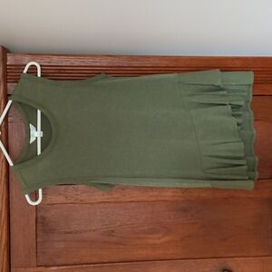 Tank top with ruffle at the bottom.